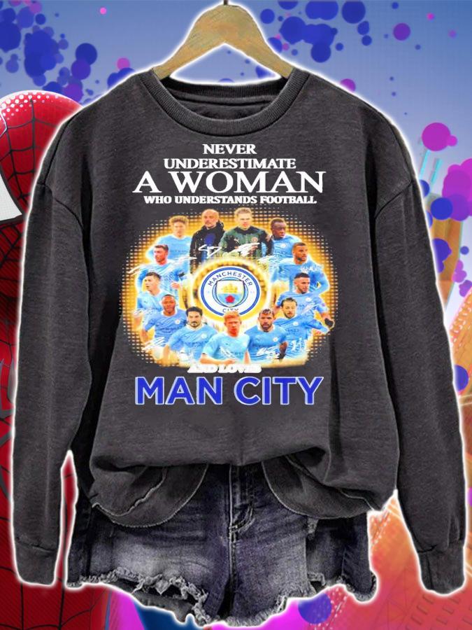 Never underestimate a woman who understands football and loves Manchester City shirt
